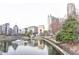 Beautiful community pond with fountain and modern architecture in the background at 390 17Th Nw St # 2024, Atlanta, GA 30363