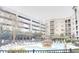 Community pool with lounge seating and shaded gazebo area at 390 17Th Nw St # 2024, Atlanta, GA 30363