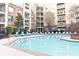 Sparkling community pool with comfortable blue lounge chairs at 390 17Th Nw St # 2024, Atlanta, GA 30363