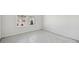 Unfurnished bedroom with neutral walls, carpeted floors, and a large window for natural light at 6902 Winchester Pl, Fairburn, GA 30213