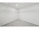 Unfinished walk-in closet with white walls and shelving at 6902 Winchester Pl, Fairburn, GA 30213