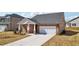 Beautiful single Gathering home with brick accents and a two car garage at 6902 Winchester Pl, Fairburn, GA 30213