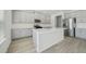 Modern kitchen with stainless steel appliances, white counters and gray cabinets at 6902 Winchester Pl, Fairburn, GA 30213