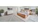 Staged main bedroom with modern furnishings, bright windows, and decor labeled as 'Virtually Staged' at 6902 Winchester Pl, Fairburn, GA 30213