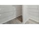 Spacious pantry with vinyl floor and white wire shelves for maximum storage capacity at 6902 Winchester Pl, Fairburn, GA 30213