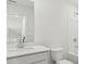 Bathroom with a quartz countertop, white sink, and a bathtub and shower at 7758 Sheffield Ter, Fairburn, GA 30213