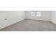 Unfurnished bedroom with neutral walls and plush carpet at 7758 Sheffield Ter, Fairburn, GA 30213