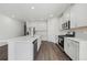 Beautiful kitchen features stainless steel appliances, granite countertops and a long island at 7758 Sheffield Ter, Fairburn, GA 30213