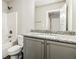 Bathroom features a granite countertop vanity and shower-tub combo at 1340 Slaton Manor Dr, Conyers, GA 30012