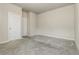 Neutral bedroom featuring plush gray carpet and light, neutral walls at 1340 Slaton Manor Dr, Conyers, GA 30012