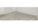 Large carpeted bedroom space with neutral colors and natural light at 1340 Slaton Manor Dr, Conyers, GA 30012