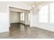 Bright dining area featuring wood flooring, fresh paint, and lots of natural light at 1340 Slaton Manor Dr, Conyers, GA 30012