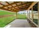 Covered patio offers outdoor living space and view of the backyard at 1340 Slaton Manor Dr, Conyers, GA 30012