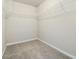 Walk-in closet with wall-mounted wire shelving and carpeted floors at 1340 Slaton Manor Dr, Conyers, GA 30012