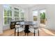 Bright dining area featuring a round table, modern chairs, and large windows with natural light at 343 Concord St, Alpharetta, GA 30009