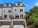 Townhome with private garage, deck, and backyard area, perfect for outdoor living and entertaining at 343 Concord St, Alpharetta, GA 30009