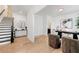 Bright foyer with wood floors features an open staircase with black banister and offers access to an elegant office space at 343 Concord St, Alpharetta, GA 30009