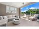 Inviting outdoor patio featuring a lounge area with a fire pit and a view of the surrounding greenery at 343 Concord St, Alpharetta, GA 30009