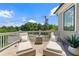 Relaxing rooftop deck with chaise lounges and a small table overlooking the neighborhood trees and blue sky at 343 Concord St, Alpharetta, GA 30009