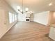 Open concept living space with wood look floors, electric fireplace, and recessed lighting at 5295 Greenway Dr, Villa Rica, GA 30180