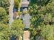 High angle view of a well-maintained home with a dark gray roof, surrounded by mature trees at 1467 Thompson Pl, Decatur, GA 30032