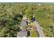 A neighborhood from above featuring mature trees and a home with a dark gray roof at 1467 Thompson Pl, Decatur, GA 30032