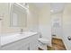 Bathroom featuring a vanity, toilet, and wainscoting at 1467 Thompson Pl, Decatur, GA 30032