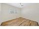 Bedroom with window, new flooring, and modern ceiling fan at 1467 Thompson Pl, Decatur, GA 30032