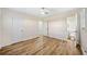 Bedroom with door to bathroom, window, new flooring, ceiling fan at 1467 Thompson Pl, Decatur, GA 30032