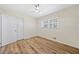 Bedroom with closet, overhead fan, window and new flooring at 1467 Thompson Pl, Decatur, GA 30032