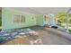 A side view of the home's carport, with painted brick and a white door at 1467 Thompson Pl, Decatur, GA 30032