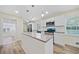 Modern kitchen featuring an island, stainless steel appliances, and sleek countertops at 1467 Thompson Pl, Decatur, GA 30032