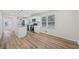Open kitchen with island, stainless appliances, and new wood floors at 1467 Thompson Pl, Decatur, GA 30032