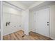 Laundry room with new flooring, bi-fold door and access to the exterior at 1467 Thompson Pl, Decatur, GA 30032