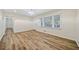 Bright living room with hardwood floors and a modern chandelier at 1467 Thompson Pl, Decatur, GA 30032