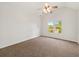 Neutral bedroom with carpet flooring, a ceiling fan, white walls, and a window providing ample natural light at 3932 E Saddle Ridge Dr, Lithonia, GA 30038