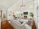 Bright living room with high ceilings, fireplace, and abundant natural light at 3932 E Saddle Ridge Dr, Lithonia, GA 30038