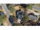 Aerial view shows the home in its neighborhood with well-manicured lawns at 5679 Brookstone Nw Walk, Acworth, GA 30101