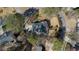 An aerial view of the property highlighting the driveway and the surrounding trees at 5679 Brookstone Nw Walk, Acworth, GA 30101
