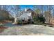 Spacious backyard featuring a well-maintained lawn and deck area, surrounded by mature trees at 5679 Brookstone Nw Walk, Acworth, GA 30101
