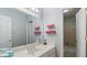 Bathroom with neutral walls, a long vanity, and a shower and tub in the background at 5679 Brookstone Nw Walk, Acworth, GA 30101