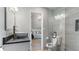 Contemporary bathroom with a vessel sink, glass shower, toilet, and a view of the adjacent bedroom at 5679 Brookstone Nw Walk, Acworth, GA 30101