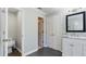 Spacious bathroom with tiled floors, a double-door closet, a water closet, and a vanity with a marble countertop at 5679 Brookstone Nw Walk, Acworth, GA 30101