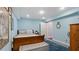 Bedroom features blue walls, rug, and a well-lit cozy space at 5679 Brookstone Nw Walk, Acworth, GA 30101