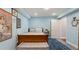 Bedroom with light blue walls, an area rug, and a comfortable bed at 5679 Brookstone Nw Walk, Acworth, GA 30101