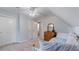 Charming bedroom with a ceiling fan, carpet floors, a double-door closet, and a wood dresser with a mirror at 5679 Brookstone Nw Walk, Acworth, GA 30101