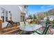 Outdoor wooden deck with glass table, seating, grill and lounge chairs perfect for backyard enjoyment at 5679 Brookstone Nw Walk, Acworth, GA 30101