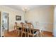 Traditional dining room featuring a wooden table and chairs, crown molding, and chandelier lighting at 5679 Brookstone Nw Walk, Acworth, GA 30101