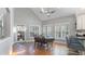 Sunlit dining area with vaulted ceiling, skylight, and direct access to the backyard patio at 5679 Brookstone Nw Walk, Acworth, GA 30101