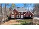 Beautiful two-story red brick home with black shutters and a well-maintained front yard at 5679 Brookstone Nw Walk, Acworth, GA 30101